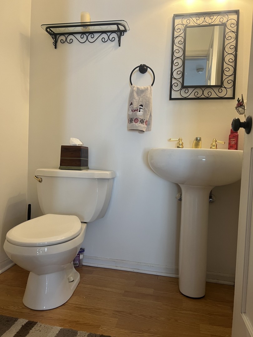 1707 Pine Road Homewood, IL 60430 - Photo 8 of 22 a bathroom with a toilet and a sink
