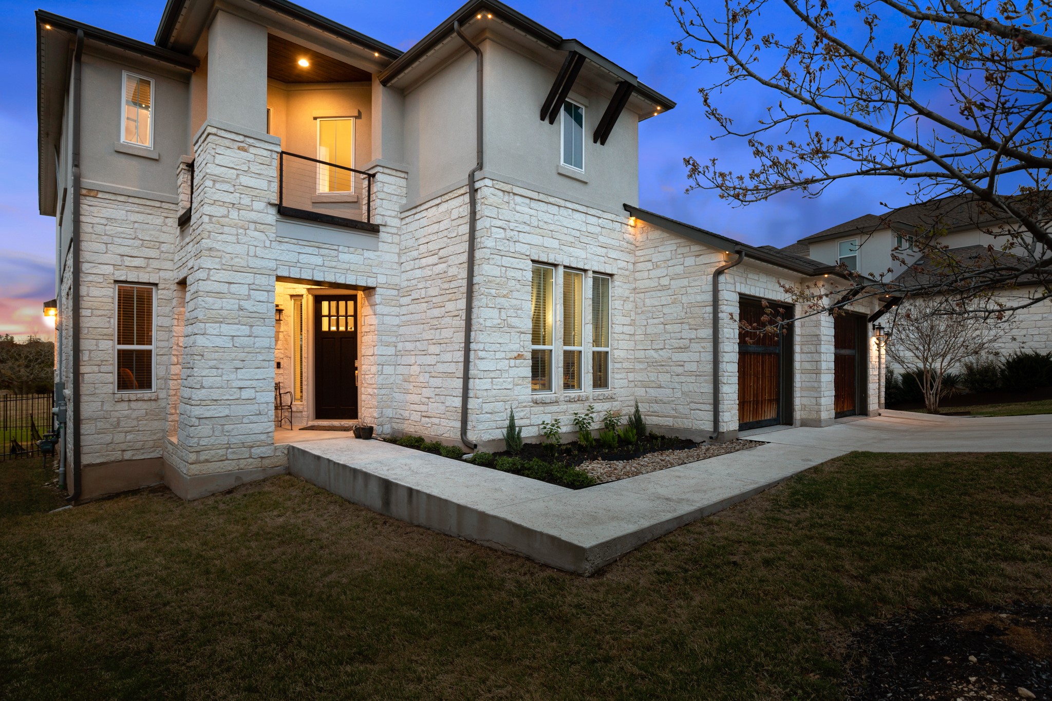 330 Cistern Way Austin, TX 78737 - Photo 38 of 40 a front view of a house with a garden and yard