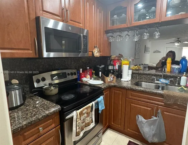 a kitchen with a stove and a microwave