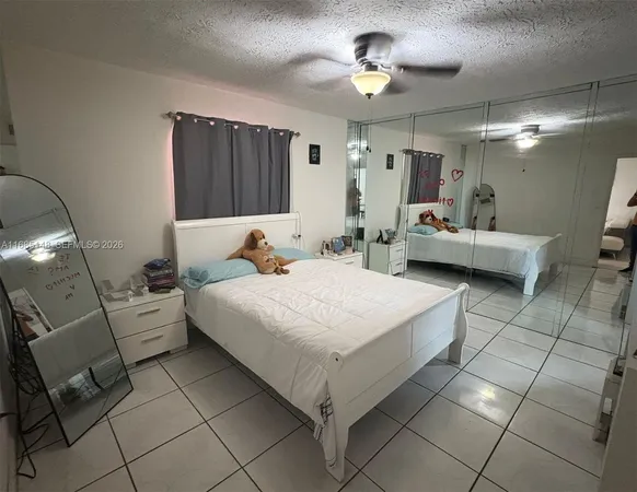 a bed room with a bed and a chandelier