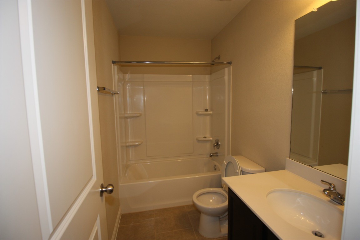 3804 Kennedy Grace Lane Austin, TX 78728 - Photo 17 of 21 a bathroom with a sink toilet and shower
