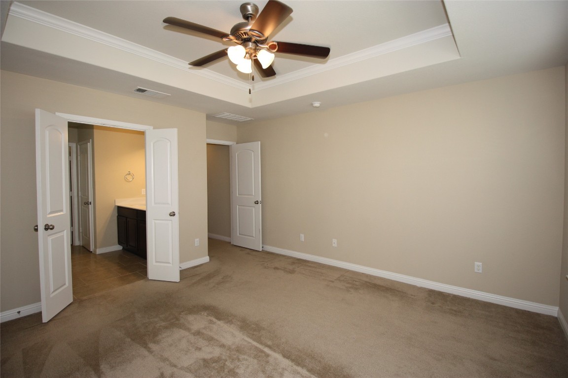 3804 Kennedy Grace Lane Austin, TX 78728 - Photo 8 of 21 an empty room with closet and a chandelier fan