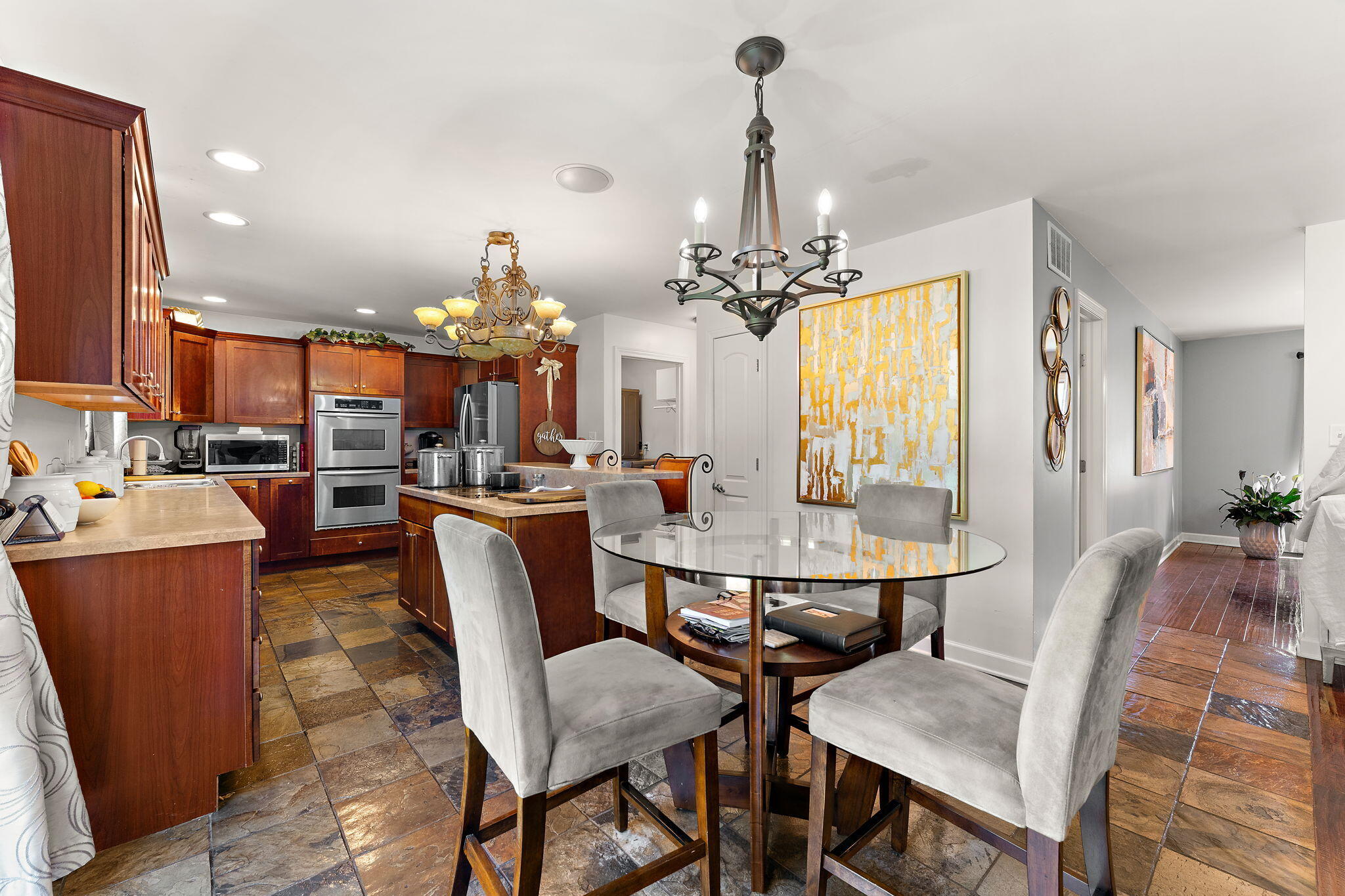 5371 72nd Avenue Schererville, IN 46375 - Photo 7 of 28 a view of a dining room with furniture and chandelier