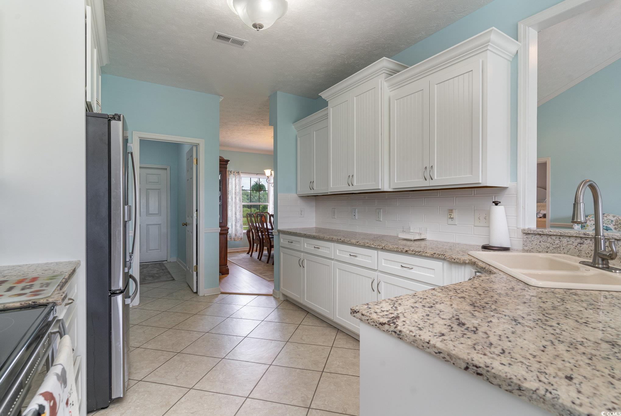 1168 Floyd Page Road Galivants Ferry, SC 29544 - Photo 11 of 37 Kitchen featuring white cabinetry, stainless steel