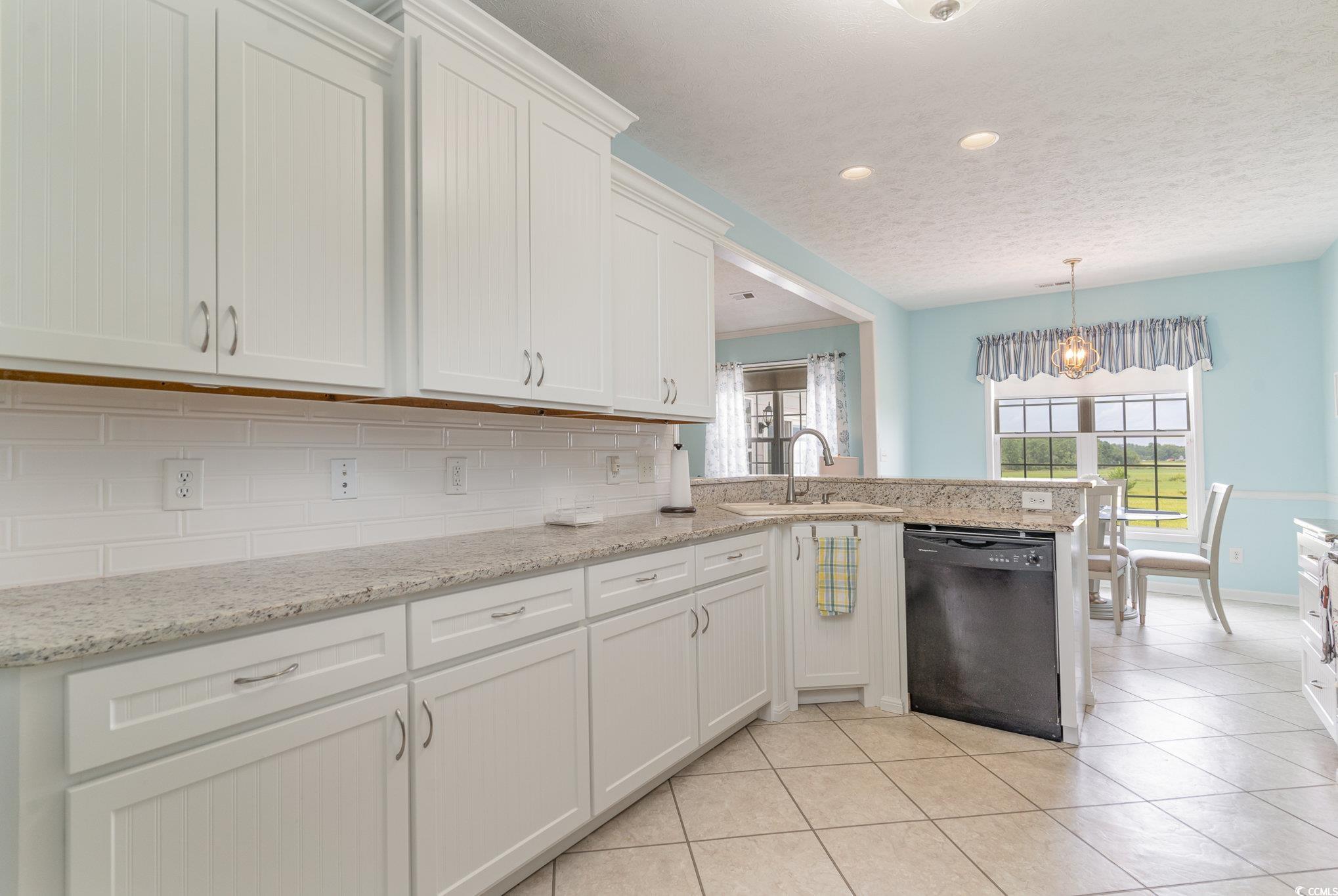 1168 Floyd Page Road Galivants Ferry, SC 29544 - Photo 12 of 37 Kitchen with black dishwasher, tasteful backsplash
