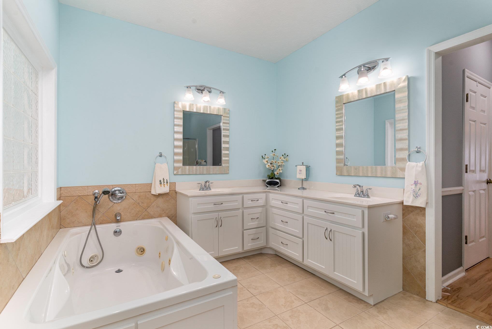 1168 Floyd Page Road Galivants Ferry, SC 29544 - Photo 20 of 37 Bathroom featuring large double vanities, jetted t