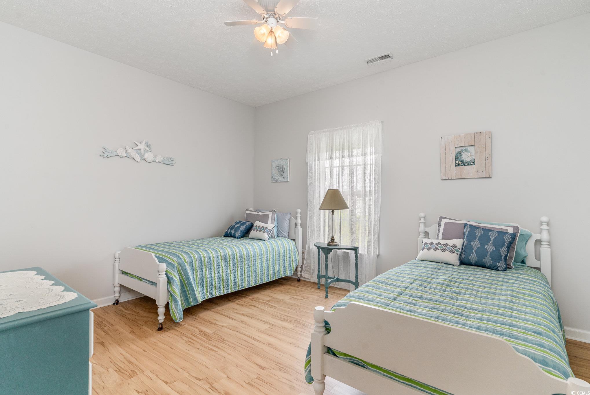 1168 Floyd Page Road Galivants Ferry, SC 29544 - Photo 22 of 37 Bedroom with light wood-type flooring and ceiling