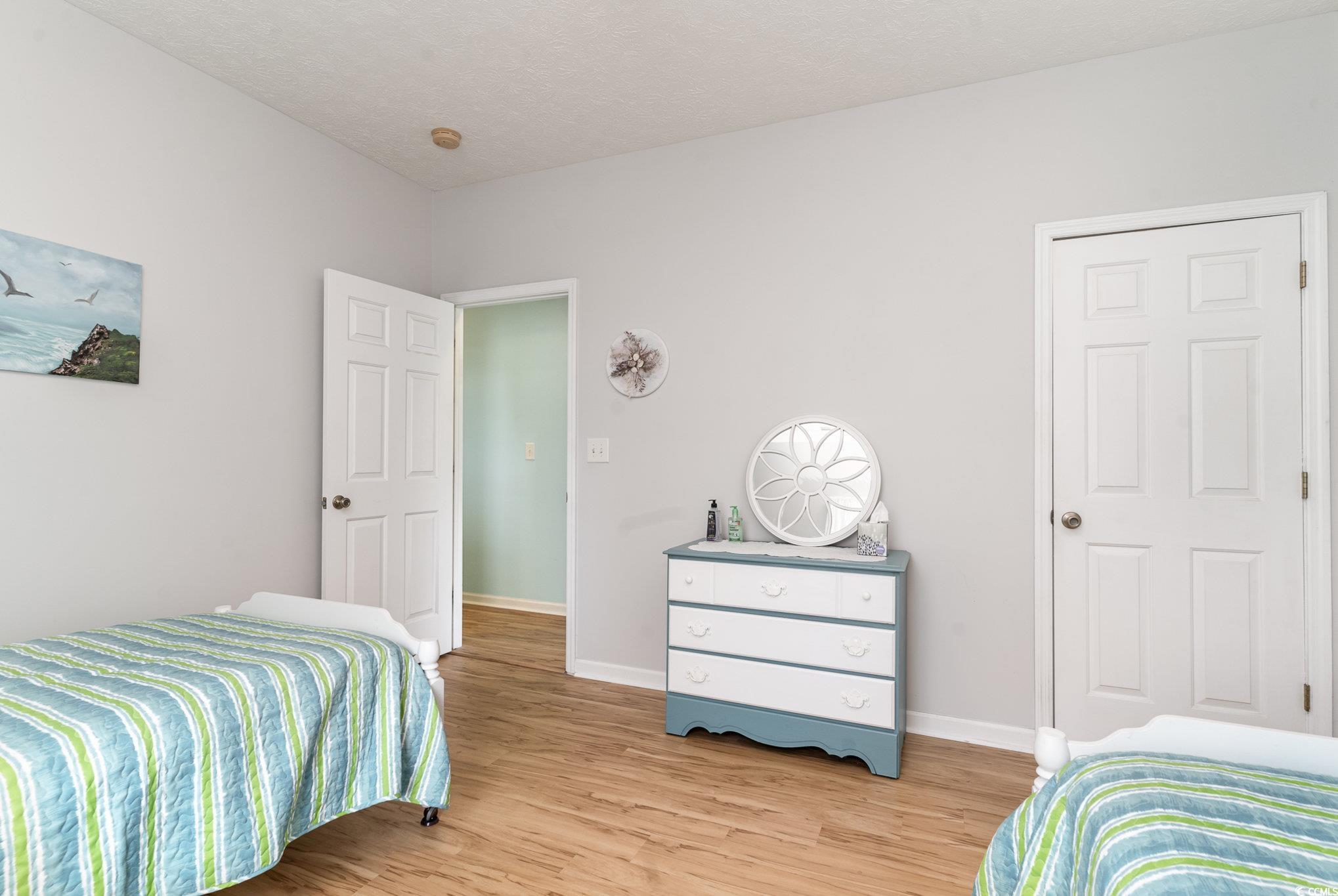 1168 Floyd Page Road Galivants Ferry, SC 29544 - Photo 23 of 37 Bedroom featuring light wood-type flooring and two