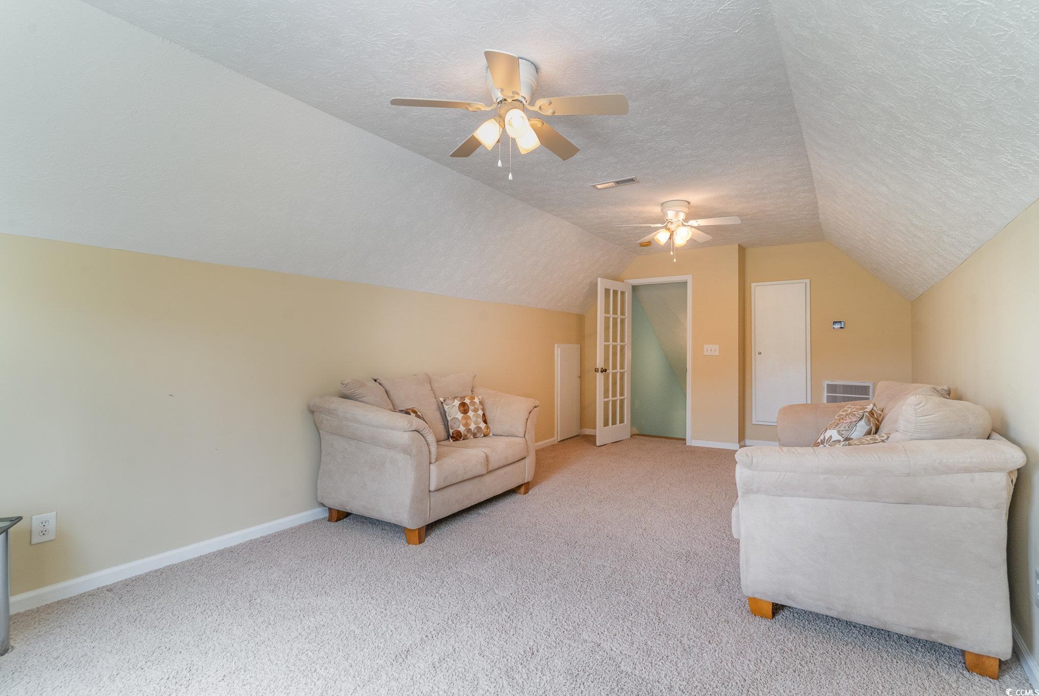 1168 Floyd Page Road Galivants Ferry, SC 29544 - Photo 28 of 37 Carpeted living room featuring a textured ceiling,