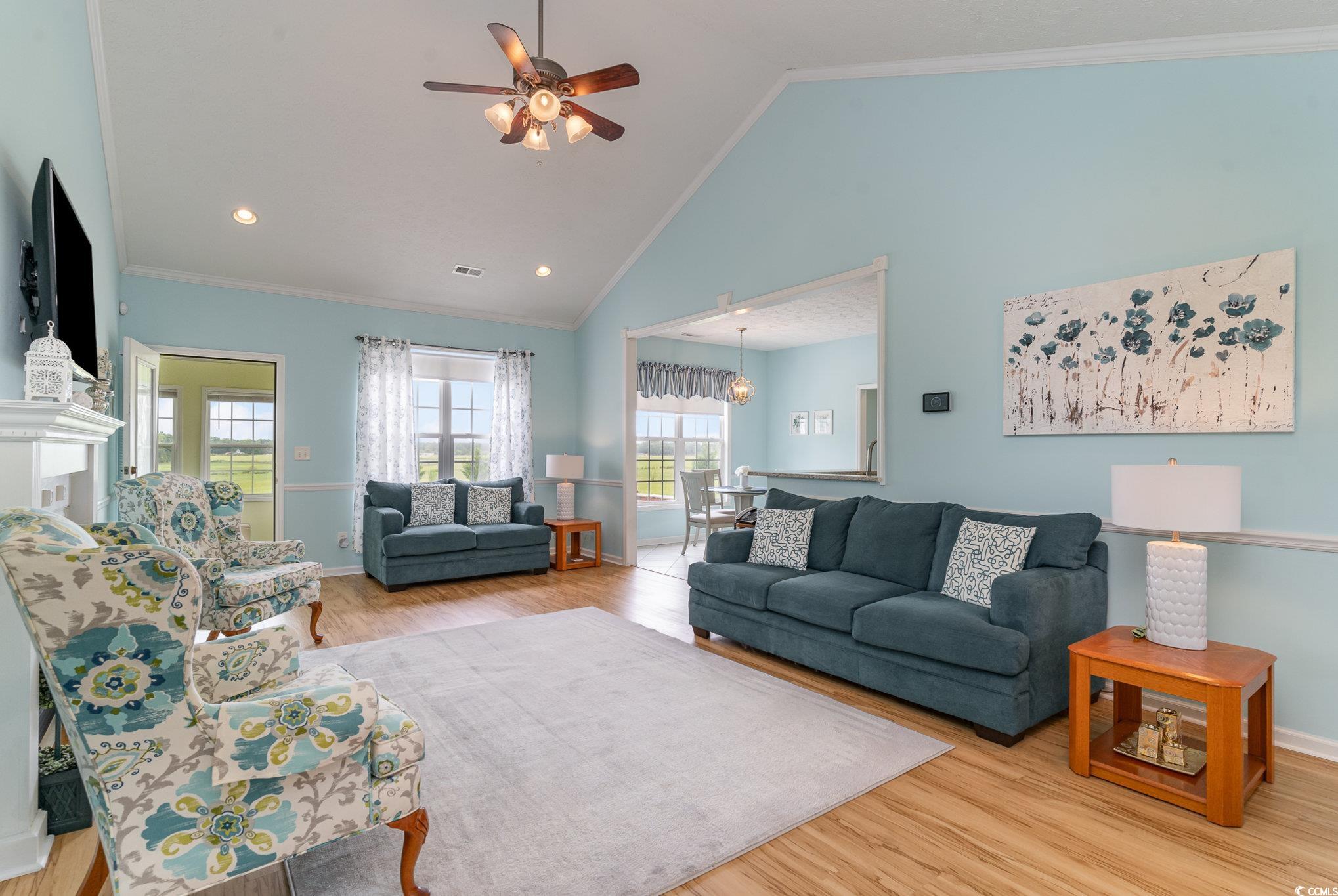1168 Floyd Page Road Galivants Ferry, SC 29544 - Photo 6 of 37 Living room featuring crown molding, light hardwoo