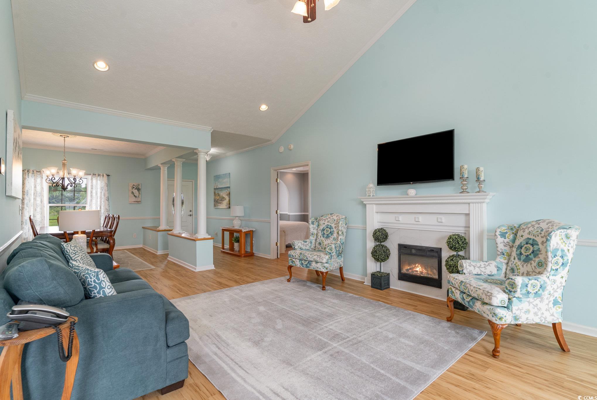 1168 Floyd Page Road Galivants Ferry, SC 29544 - Photo 7 of 37 Living room featuring ornate columns, light hardwo