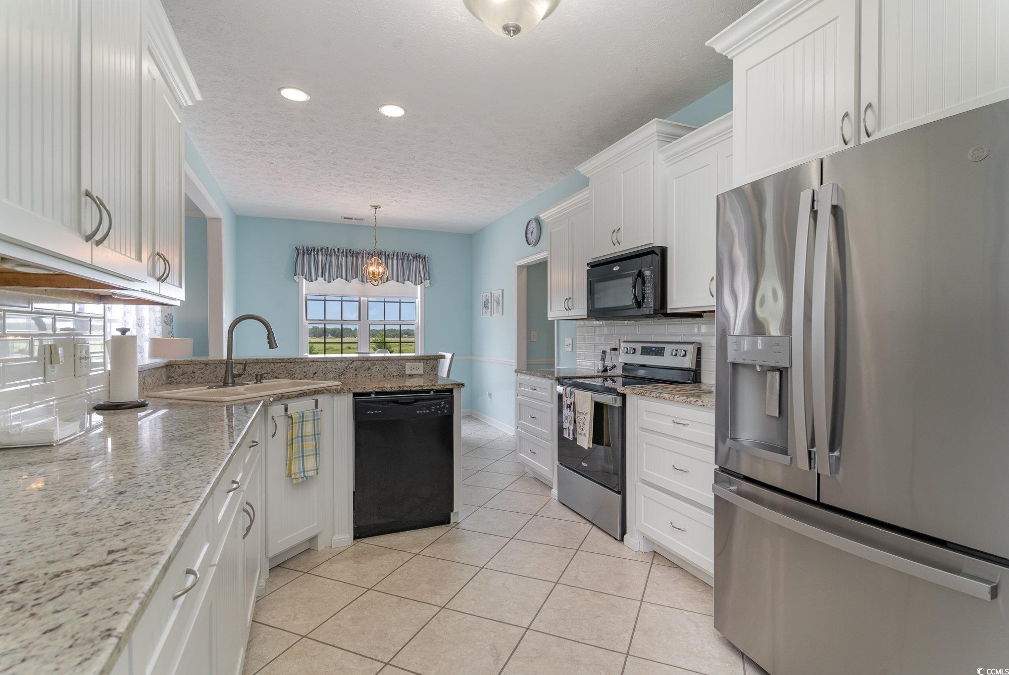 1168 Floyd Page Road Galivants Ferry, SC 29544 - Photo 10 of 37 Kitchen featuring white cabinets, black appliances