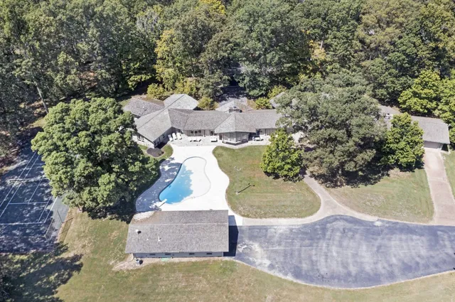 an aerial view of a house with outdoor space