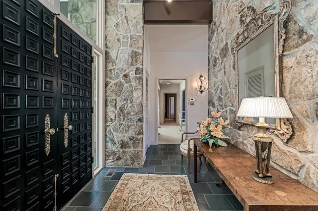 a living room with furniture and a rug