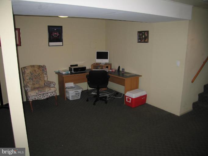 701 Gilmarys Road Baltimore, MD 21210 - Photo 22 of 23 a living room with furniture and a flat screen tv