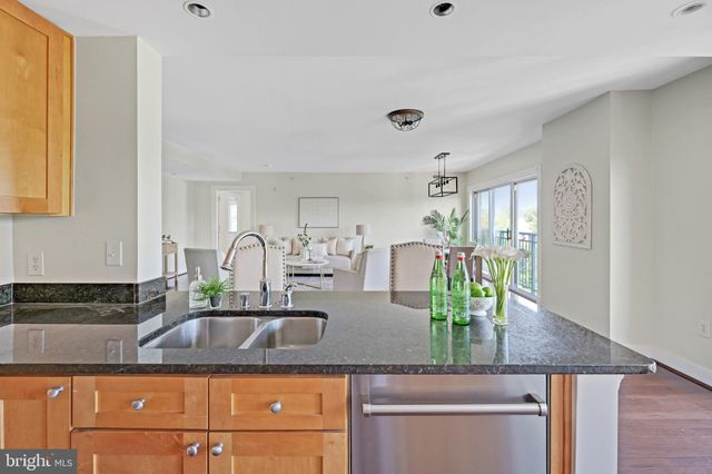 a large bed sitting in a bedroom next to a window