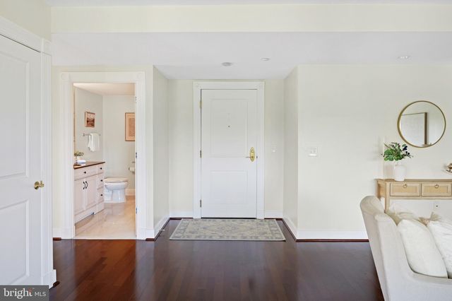 a spacious bathroom with a granite countertop tub sink and mirror