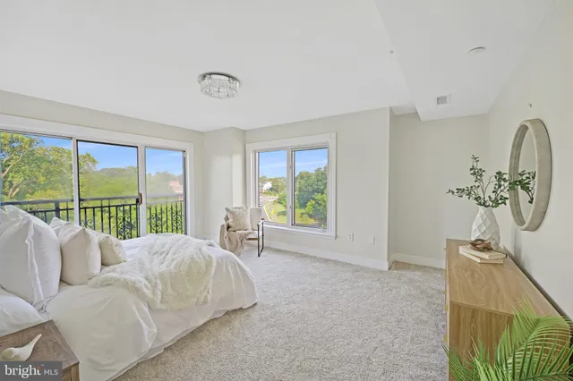 a bathroom with a granite countertop sink and a large mirror