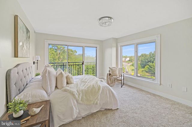 a bathroom with a granite countertop sink a toilet and a mirror