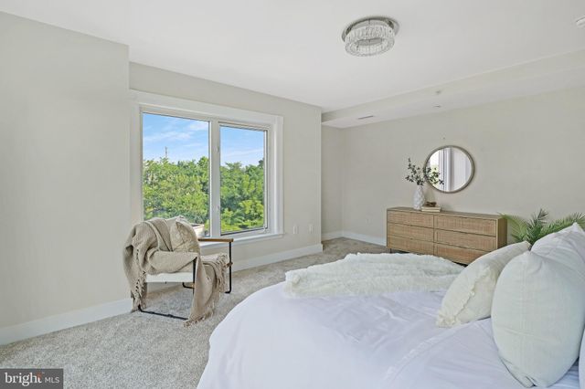 a bath room with a granite countertop sink and a mirror