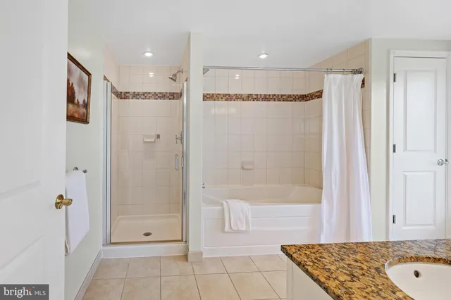 a white bath tub sitting next to a white toilet