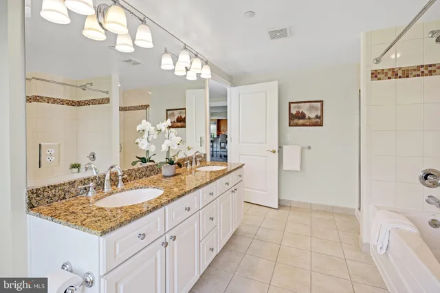 a bedroom with a bed and glass window