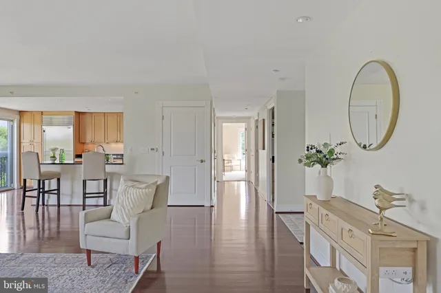 a spacious bedroom with a bed and a large window