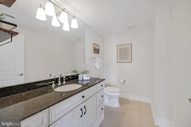 a bedroom with a bed and glass window
