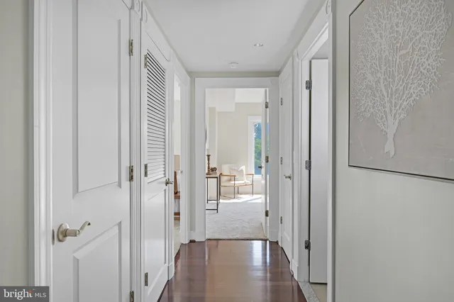 a bedroom with a bed and windows