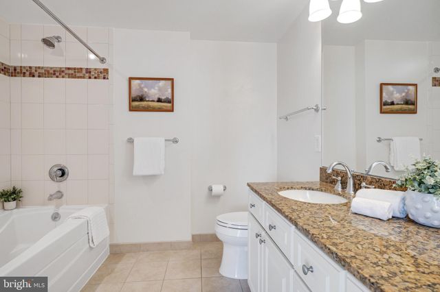 an aerial view of a house with swimming pool and outdoor space