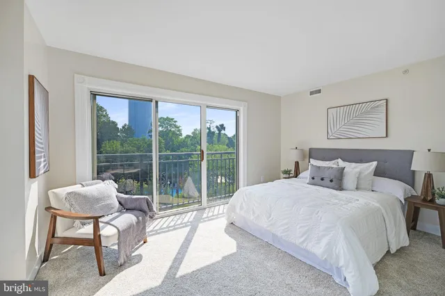 an aerial view of a house with swimming pool and outdoor space