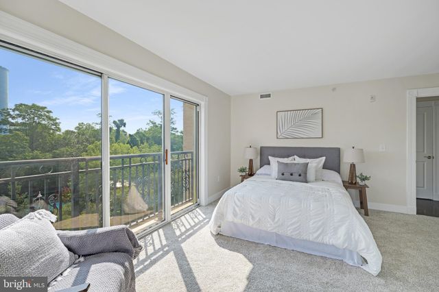 an aerial view of multiple houses with a yard