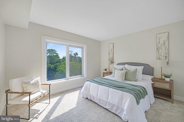 a living room with furniture and a book shelf