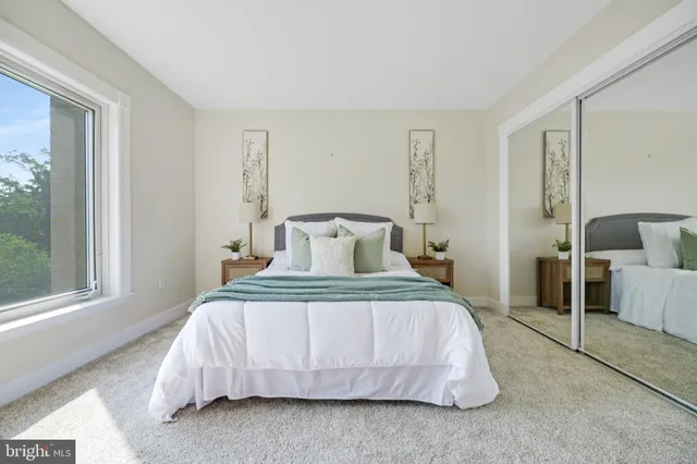 a living room with furniture and a lamp
