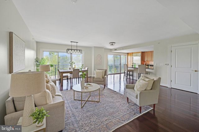 a dining room with furniture window outside view and wooden floor