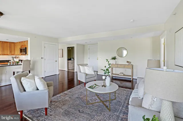 a dining room with furniture window outside view and wooden floor