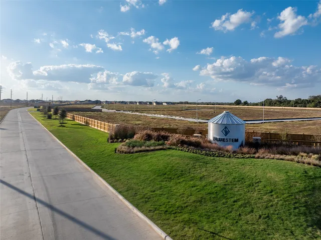 a view of a lake with a yard