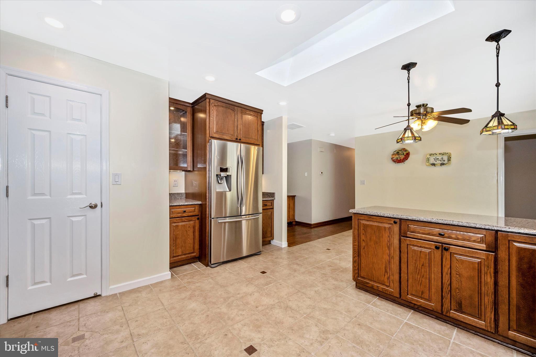 6345 Davis Road Mount Airy, MD 21771 - Photo 20 of 76 kitchen peninsula, fridge and large pantry