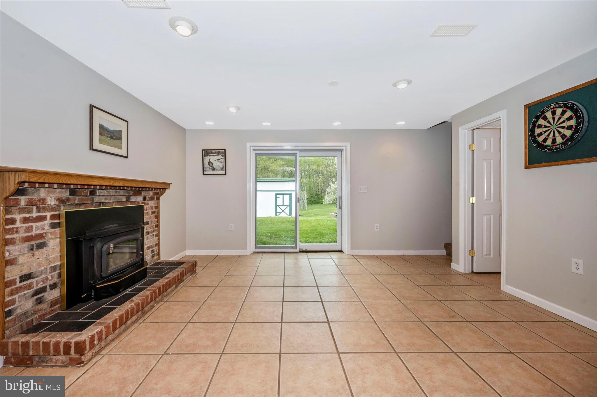 6345 Davis Road Mount Airy, MD 21771 - Photo 39 of 76 fireplace and sliders to backyard on LL