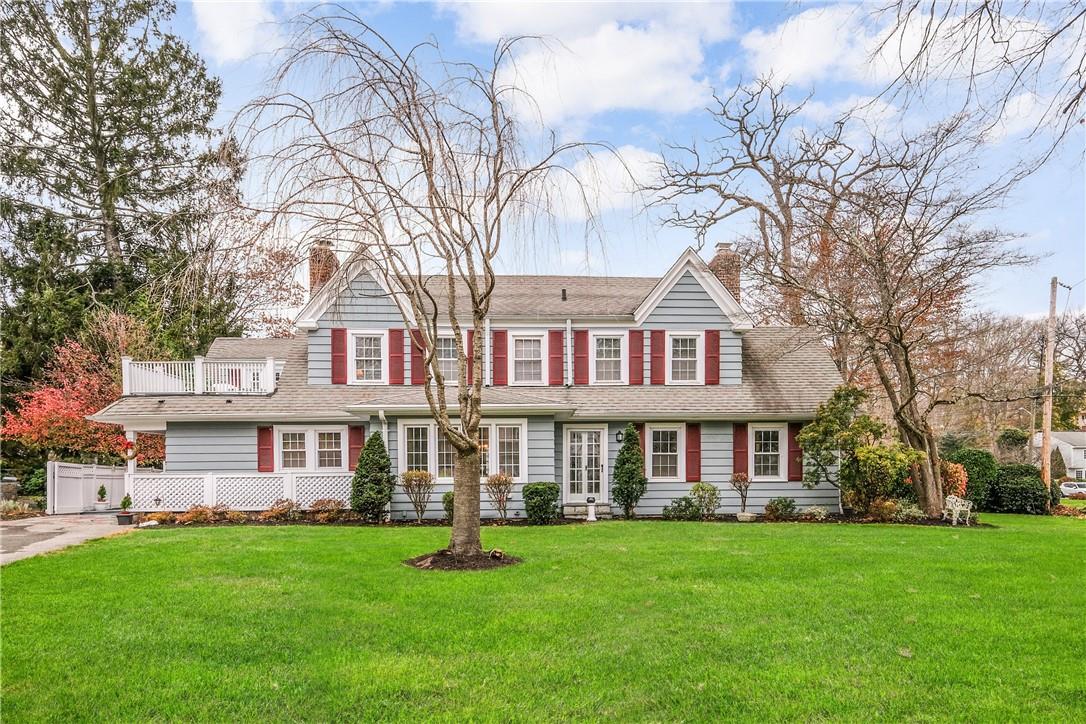 23 Donellan Road Scarsdale, NY 10583 - Photo 1 of 1 front view of a brick house with a yard