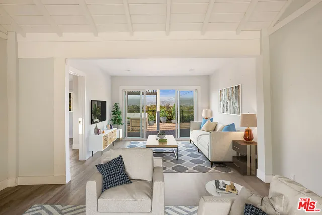 a kitchen with granite countertop a refrigerator stove and sink