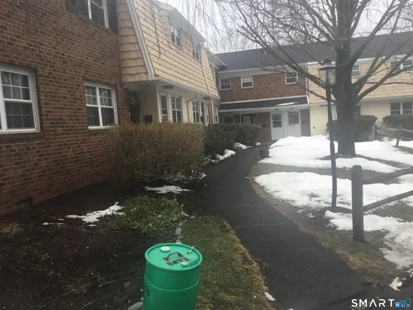 a view of a backyard with table and chairs
