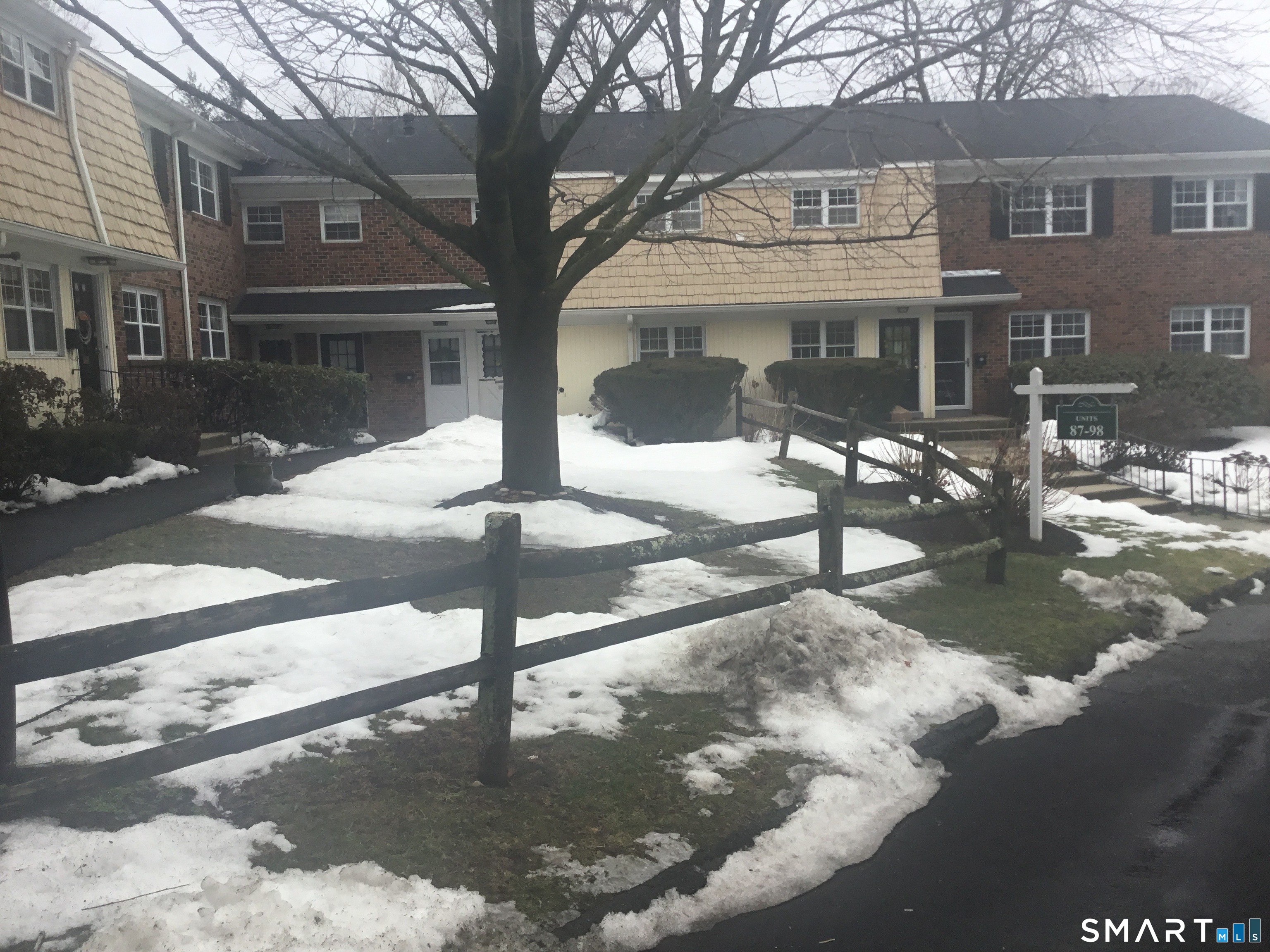 245 Unquowa Road, Unit 93 Fairfield, CT 06824 - Photo 3 of 11 a view of a building with street
