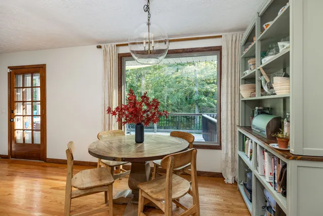 a kitchen with white cabinets and a sink