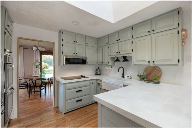a view of a dining room with furniture and window