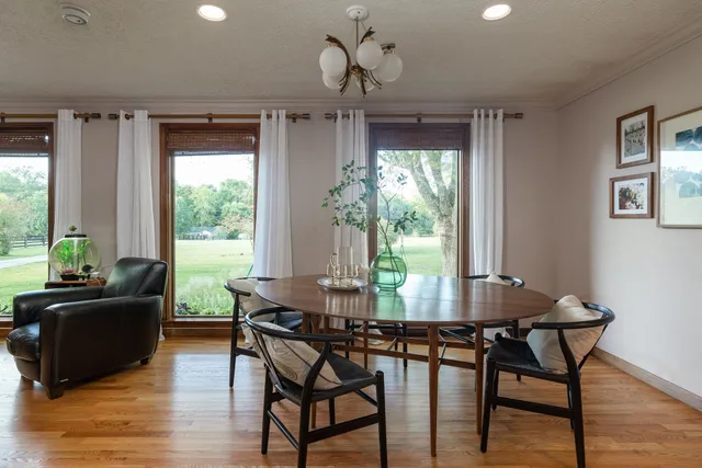 a living room with furniture and a lamp