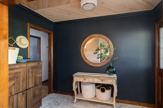 a bathroom with a toilet a sink and a window