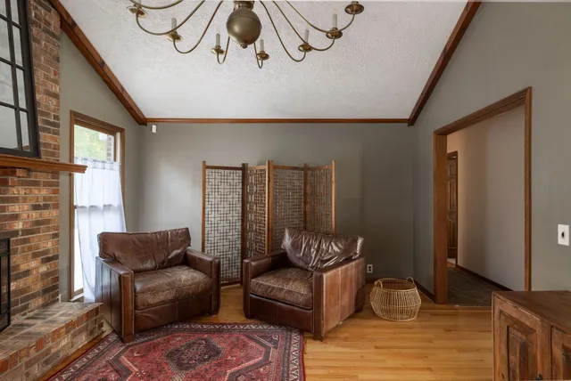 a bedroom with a bed dresser and a window