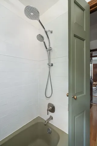 a view of a hall with wooden floors