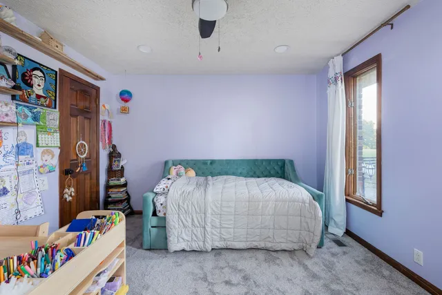 an aerial view of a house with yard